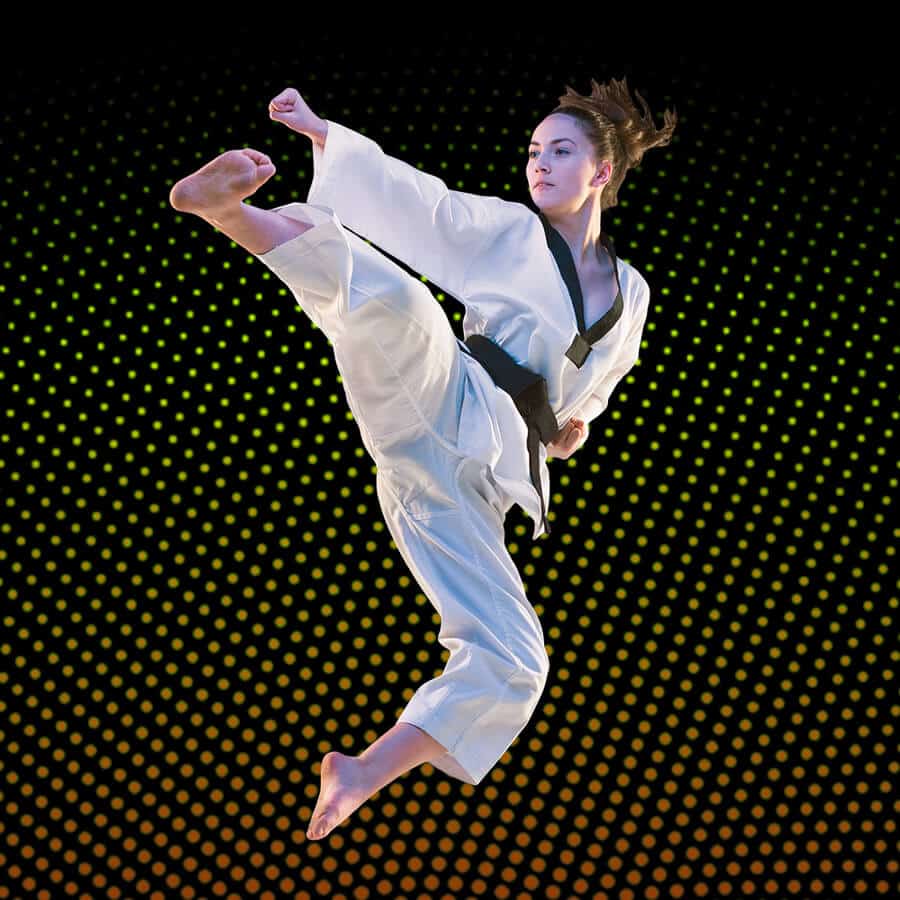 Martial Arts Lessons for Adults in Lanham MD - Girl Black Belt Jumping High Kick