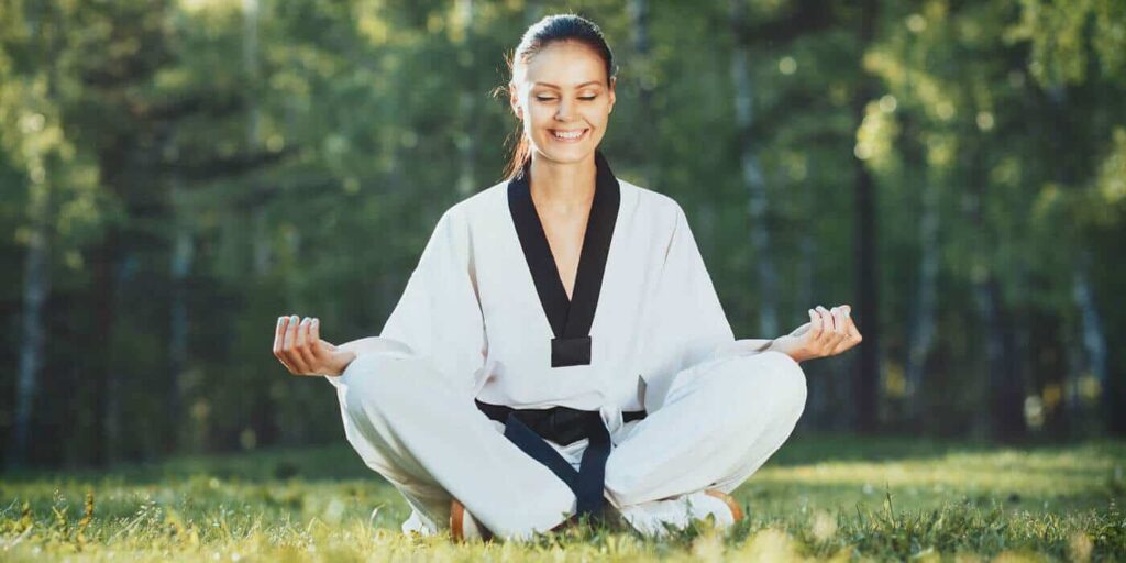 Martial Arts Lessons for Adults in Lanham MD - Happy Woman Meditated Sitting Background