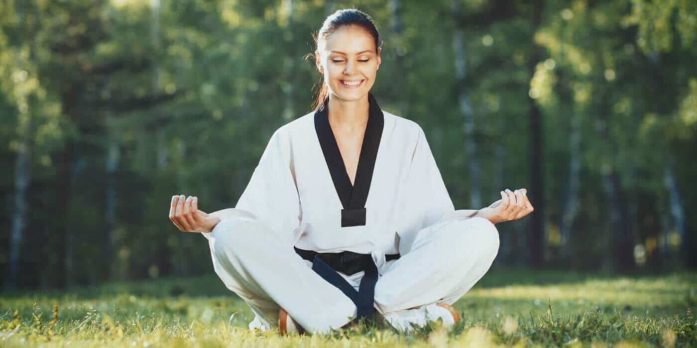 Martial Arts Lessons for Adults in Lanham MD - Happy Woman Meditated Sitting Background